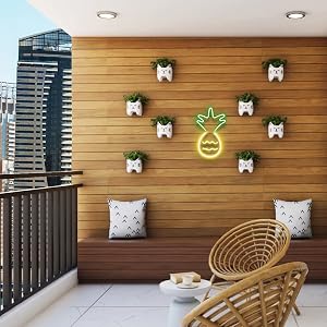 Pineapple LED sign on a balcony